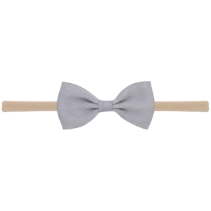 Detailed view of baby headband with a light grey herringbone pattern bow on nylon