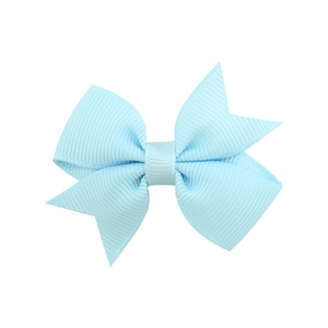 Macro detail of a light blue double-layered grosgrain ribbon bow hairpin for girls