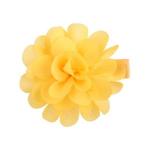 Detail of yellow chiffon flower hair clip with layered petals and ribbon-wrapped metal base