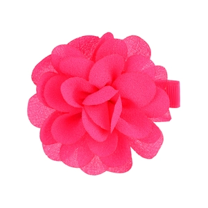 Detail view of pink chiffon flower hair clip with layered petals and ribbon wrap