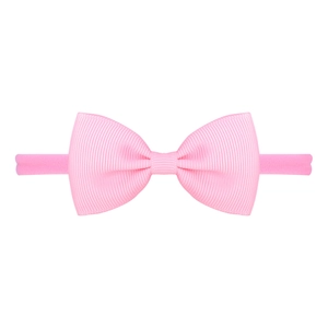 Close-up of pink grosgrain bow on soft elastic nylon headband for babies and toddlers