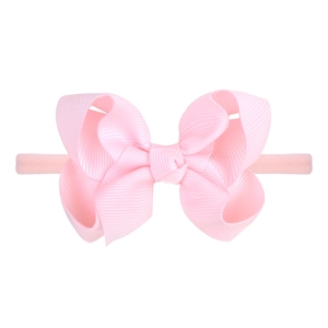 Pink grosgrain ribbon bow elastic headband for babies and toddlers on white background