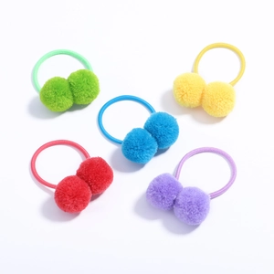 Set of five colorful plush pom pom hair ties in red, yellow, blue, green and purple