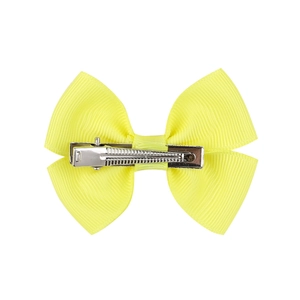 Detail of neon yellow grosgrain ribbon bow with a silver metal alligator hair clip
