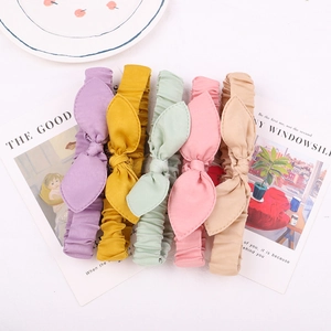 Five-piece set of macaron-colored elastic knot headbands with rabbit ear bow details