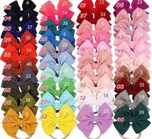 Collection of 40 colors of elastic bow headbands for girls with ribbed fabric texture