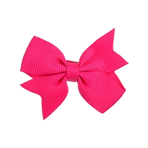 Detailed view of peach pink grosgrain ribbon swallowtail bow hair clip for girls