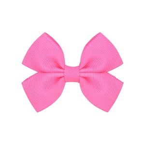 Detail of hot pink grosgrain ribbon hair bow with clear ribbed texture for girls