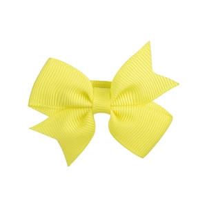 Detail view of a bright yellow double-layered grosgrain ribbon bow hair accessory