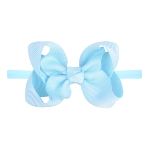 Detail of light blue layered grosgrain ribbon bow on soft elastic baby headband