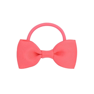 Close-up of pink grosgrain ribbon bow hair tie with detailed ribbed texture and elastic band