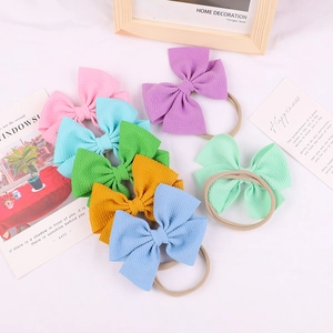 Set of 7 colorful waffle knit bow headbands with soft nylon elastic bands for baby girls
