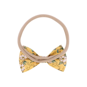 Bandeau bébé à nœud floral jaune avec élastique en nylon doux pour nourrissons