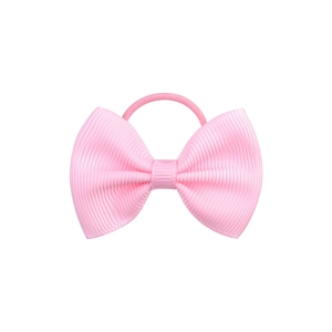 Detail of pink grosgrain bow hair tie showing ribbed texture and elastic band