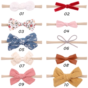 Variety pack of 10 nylon baby headbands with assorted lace and velvet fabric bows