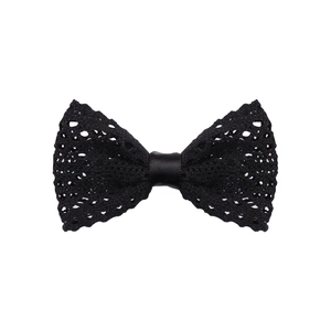 Detail of black knitted bow hair clip showing delicate mesh texture and satin center knot