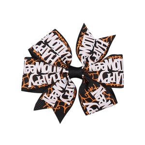 Barrette nœud Halloween noire avec toiles d'araignées orange et texte festif