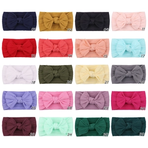 Detailed grid view of 20 colors for baby nylon headbands with large textured bows