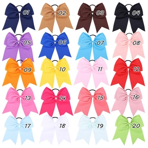 Detailed grid of 20 assorted grosgrain ribbon bow hair ties with elastic bands