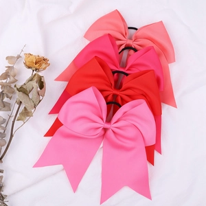 Set of four large 8-inch grosgrain ribbon hair bows in pink tones with elastic ties