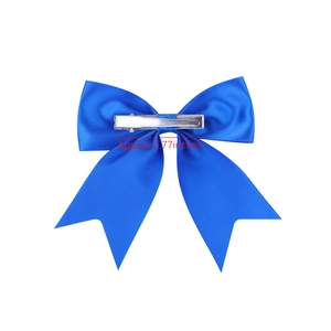 Detail showing the 1.77 inch silver alligator clip on the back of a royal blue bow