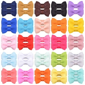 Set of 50 colorful grosgrain ribbon bow hair clips for kids and pets in varied candy colors