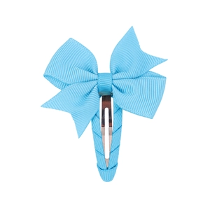 Detail of light blue grosgrain ribbon bow hair clip with fully fabric-wrapped metal base