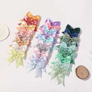 Colorful satin bow hair clips set for girls in various pastel and vibrant candy colors