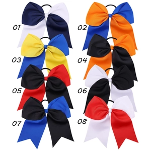 Detailed grid of eight large colorful grosgrain ribbon cheer bows with elastic bands
