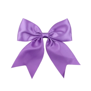 Detailed close-up of a premium purple satin bow hair clip with smooth glossy texture