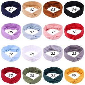Elastic cross knot headbands shown in sixteen solid Morandi colors in a grid view