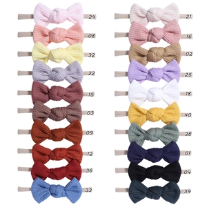 Detailed flat lay of waffle knit baby headbands in twenty different color options