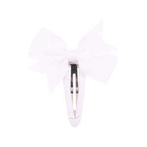 Detail of white grosgrain ribbon bow hair clip with textured fabric and BB metal clasp