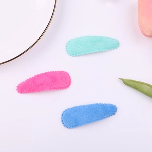 Three colorful plush hair clips in mint green, pink and blue for sweet girls