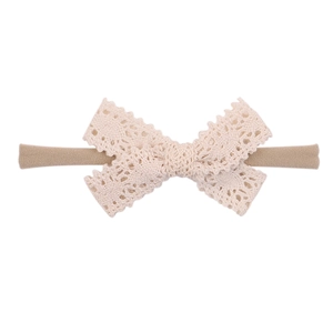 Set of ten stretchy nylon headbands with delicate cream lace bows for baby girls