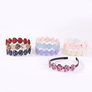 Detail showing glitter heart headbands in vibrant gradient colors for girls and parties