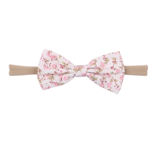 Set of 10 elastic nylon baby headbands featuring floral print bows for infants