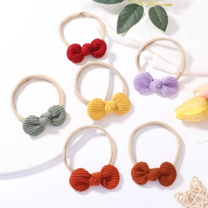 Close-up of 6-pack waffle knit bow headbands in various colors for babies and toddlers