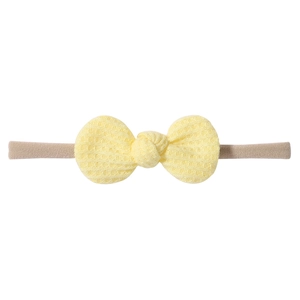 Infant waffle fabric bow headband in yellow and beige with elastic soft strap