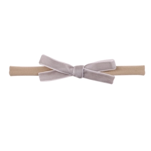 Close-up of velvet bow hairband with high-elastic nylon strap for baby comfort