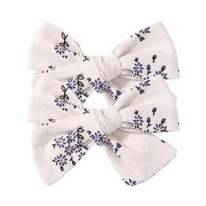 Pastoral floral bow hair clip set with cream fabric and blue flower pattern