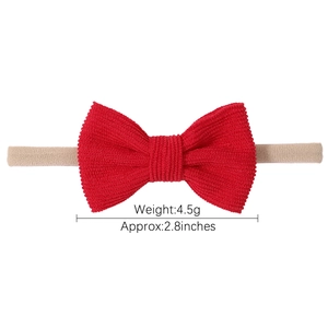 Bandeau bébé avec double nœud rouge en velours côtelé et sangle en nylon élastique