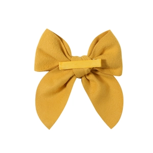 Ginger yellow satin bow hair clip with covered duckbill clip on white background