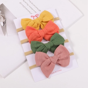 Set of 4 soft fabric bow headbands for babies in yellow orange green and pink colors