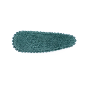 Detail view of dark green plush BB hair clip with scalloped edge design for girls