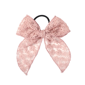 Close-up of pink lace floral bow hair tie with embroidery details and elastic band