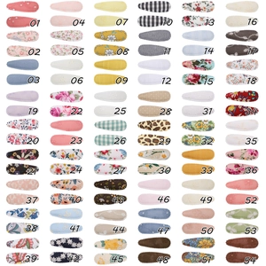 Matrix display of 54 diverse floral and solid fabric BB hair clips for girls