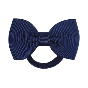 Close-up of dark blue 1.7 inch grosgrain ribbon bow on elastic nylon baby hairband