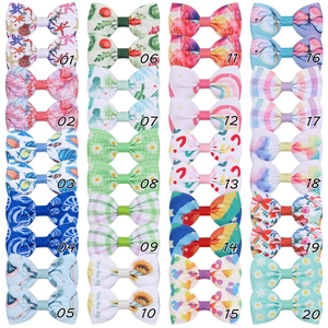 Détail de 20 barrettes à cheveux avec nœuds colorés et divers motifs imprimés mignons