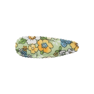 Close-up of floral fabric hair clip with pastel green pattern and zig-zag stitching
